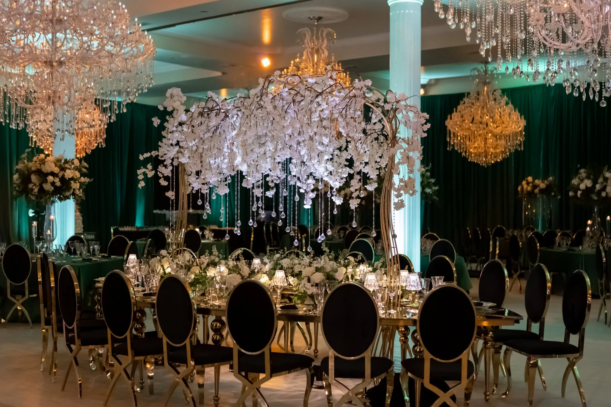 Emerald and black quinceañera with gold accents