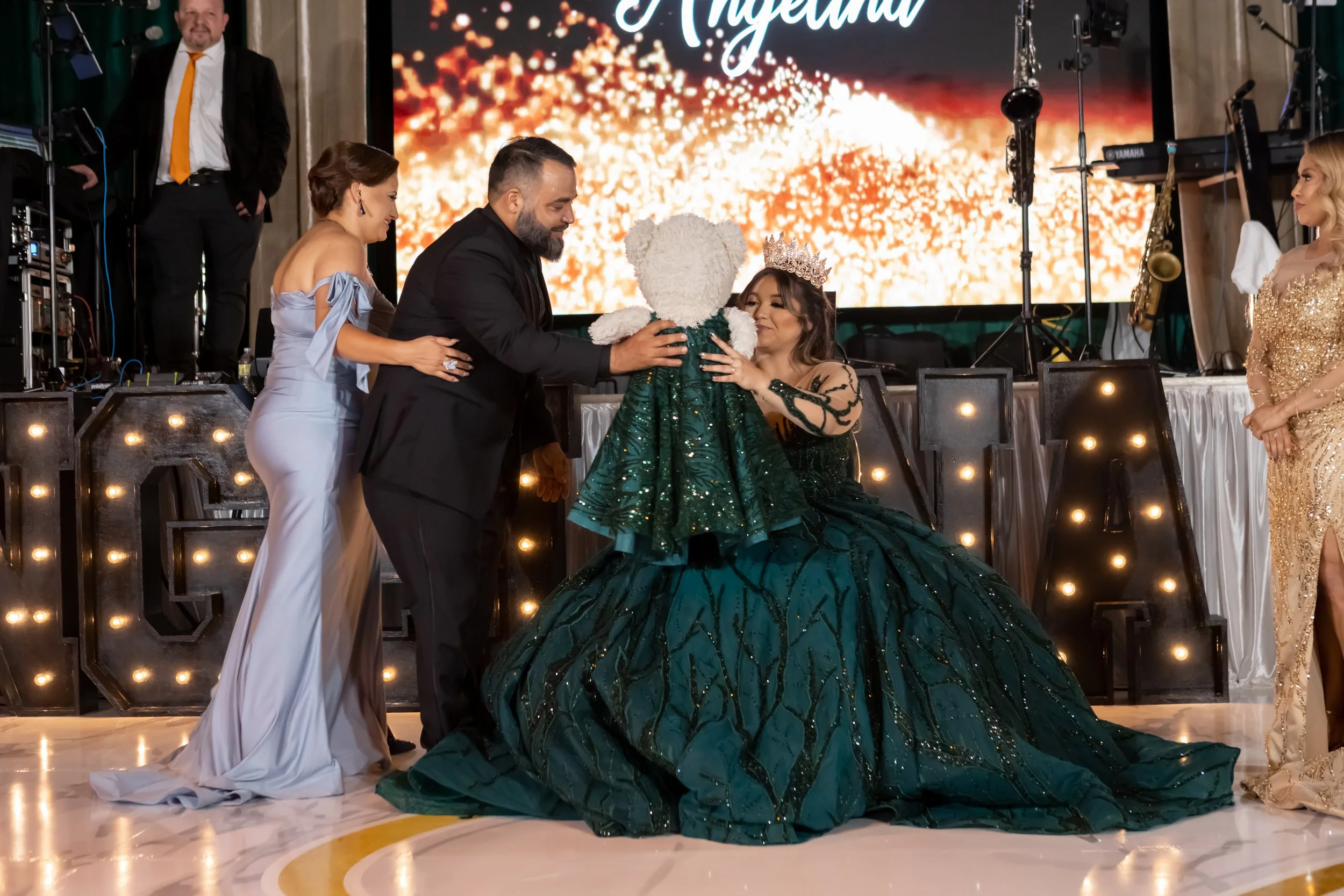 Emerald and black quinceañera with gold accents