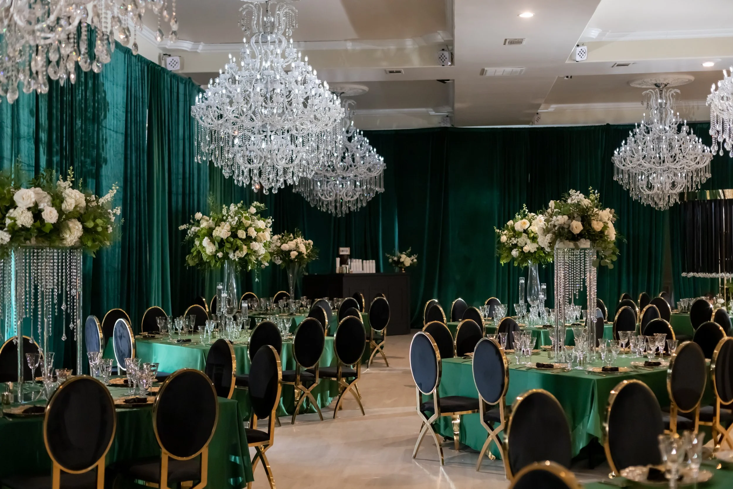 Emerald and black quinceañera with gold accents