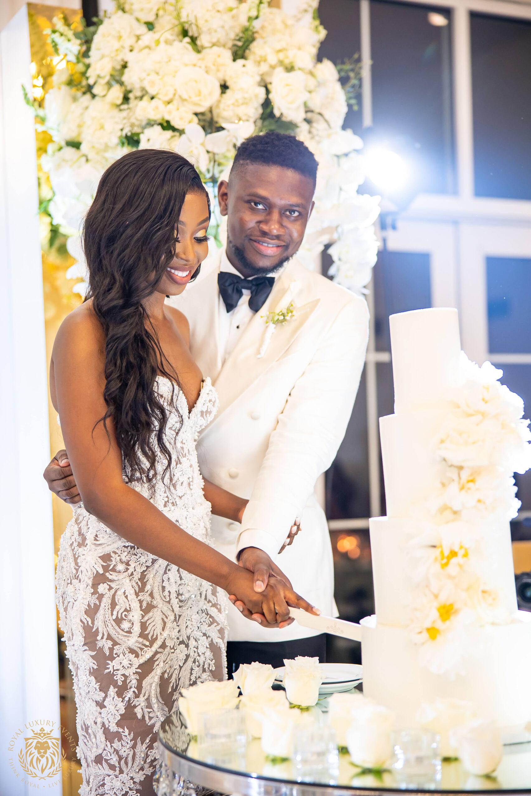 Silver & White Wedding in Dallas, Texas wedding cake cutting