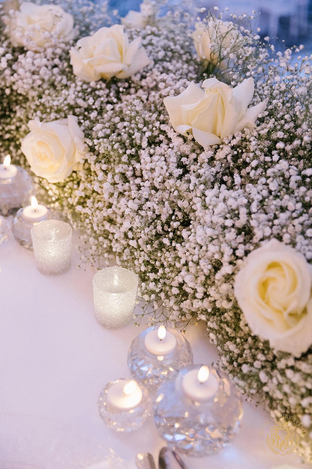 wedding reception decor houston - centerpieces - babys breath sweetheart table - candles