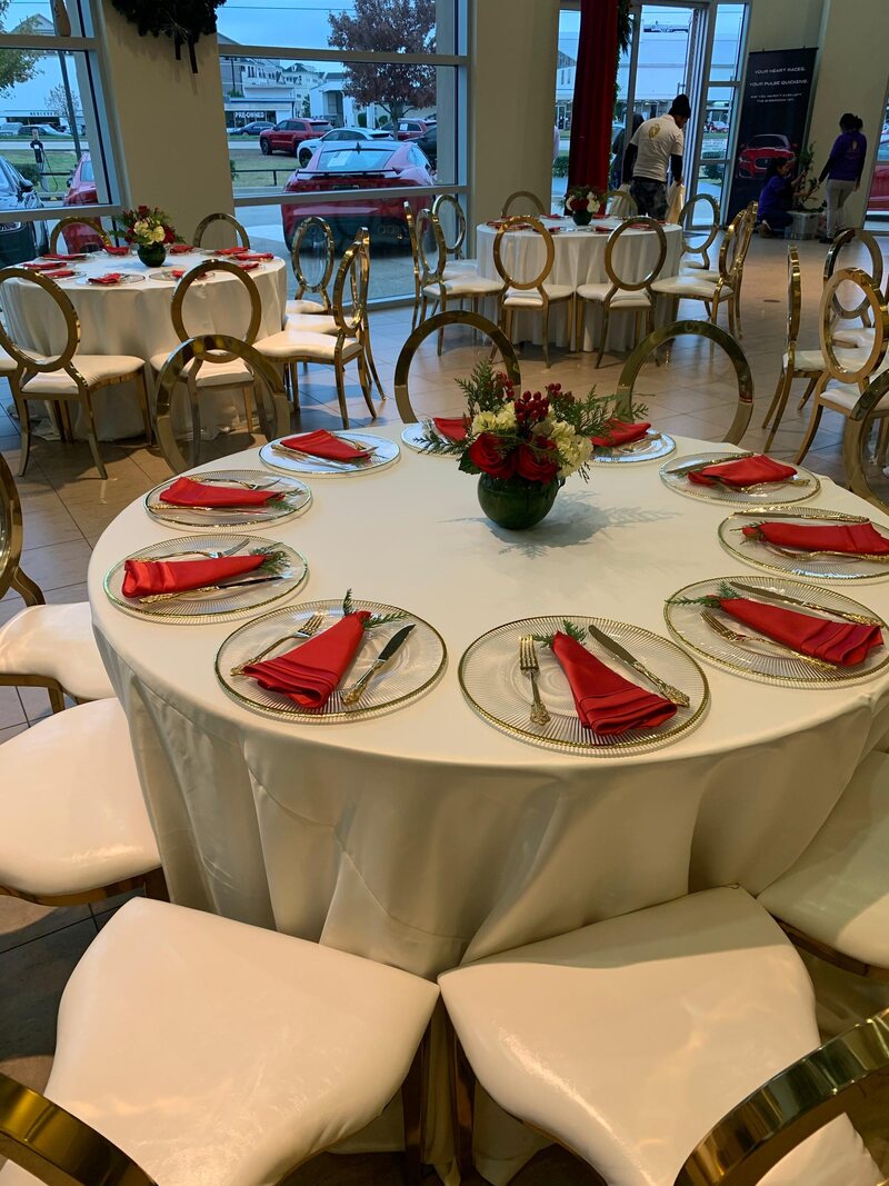 jaguar holiday party with red and white flowers