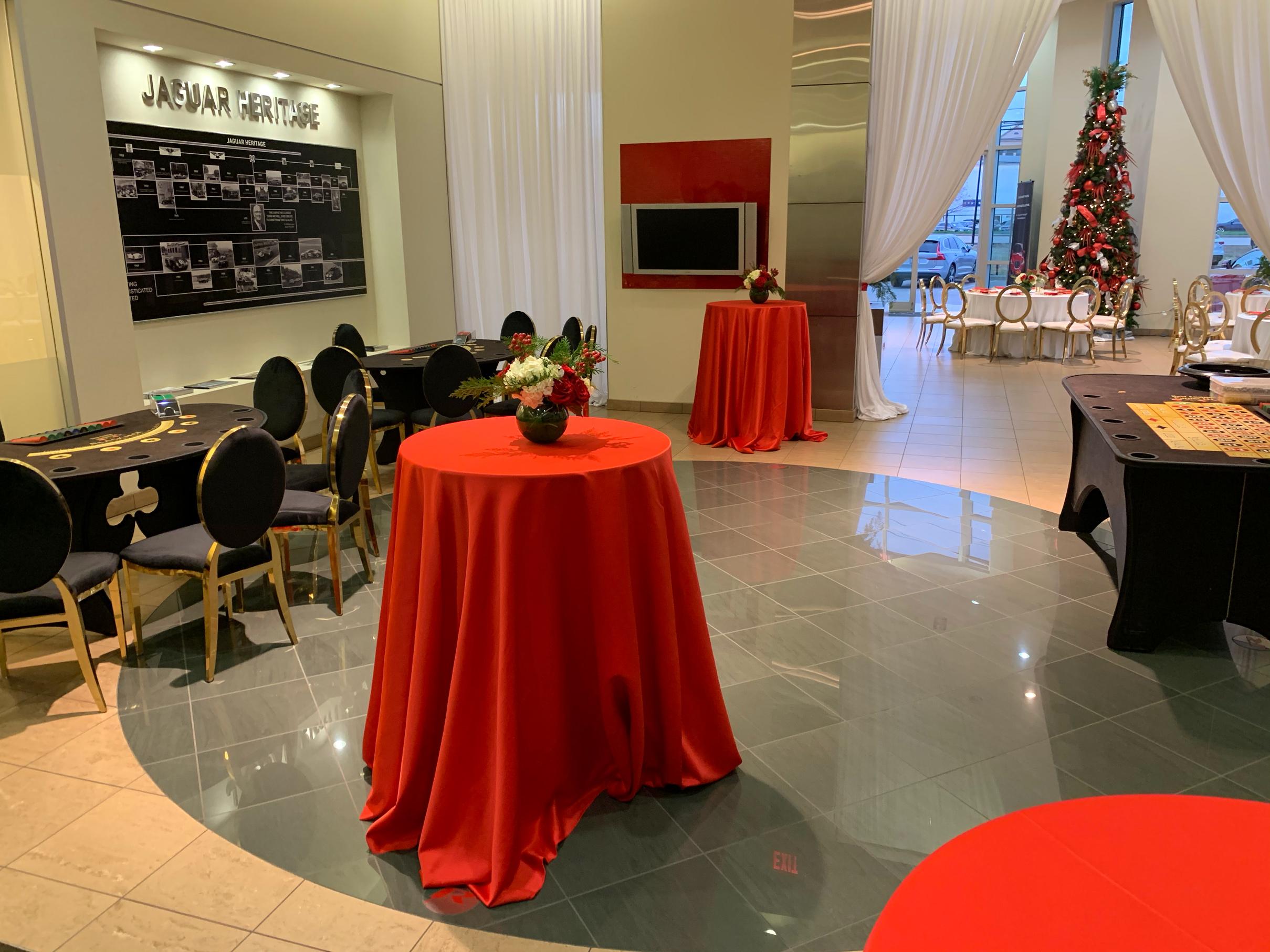 jaguar holiday party with red and white flowers