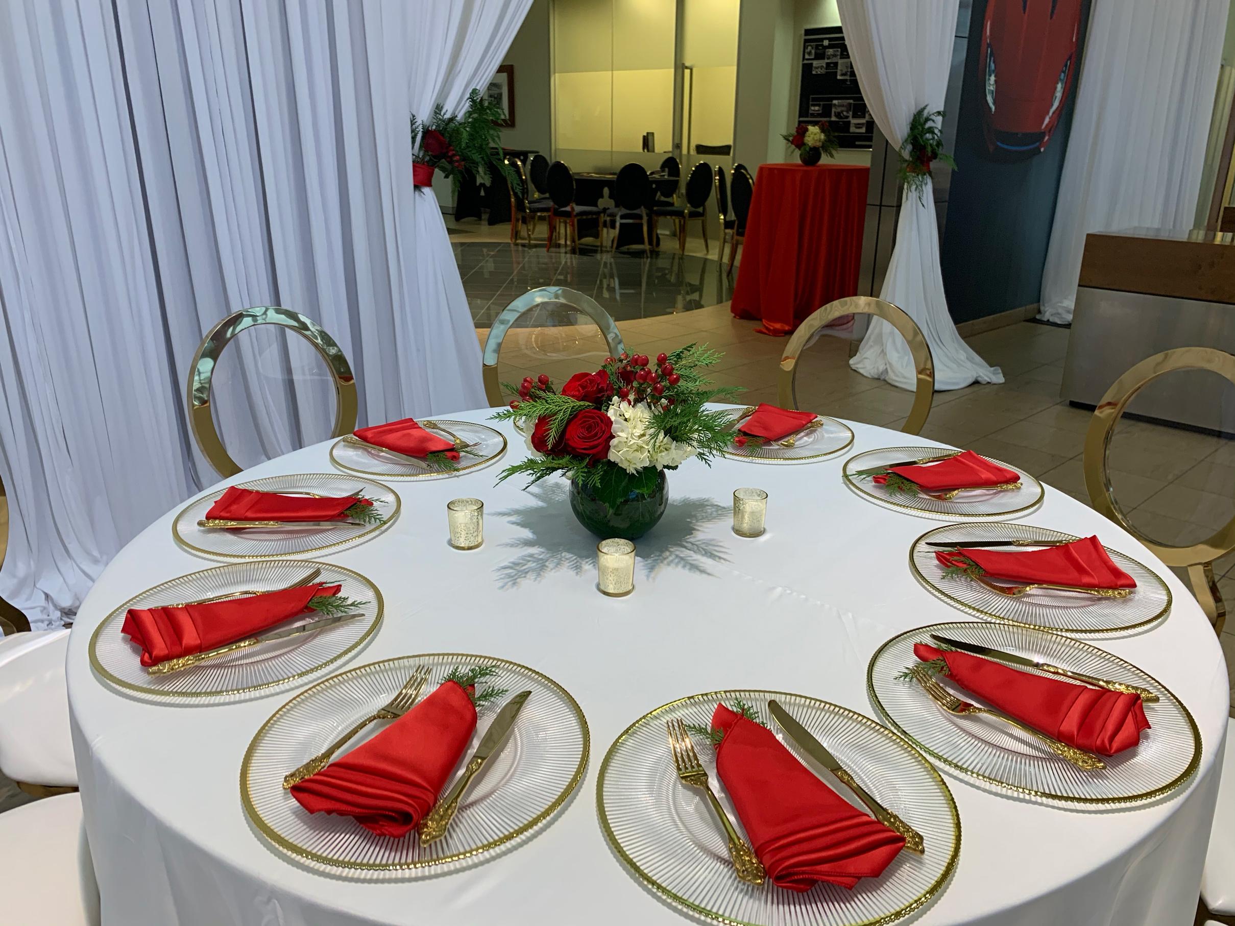jaguar holiday party with red and white flowers