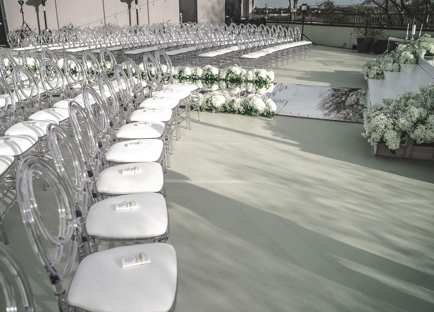 mirror aisle, royal luxury events, ceremony decor, ivory flowers, canopy, cross, clear chairs
