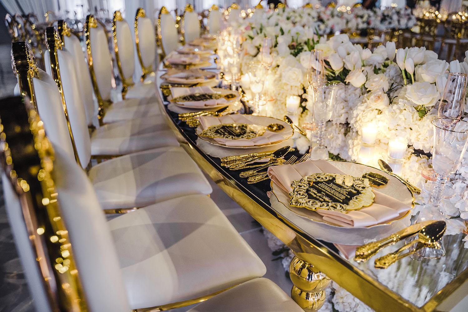 ceiling decor, cake drop, royal luxury, wedding reception decor, gold chairs, mirror tables, chargers, tableware, circle arch