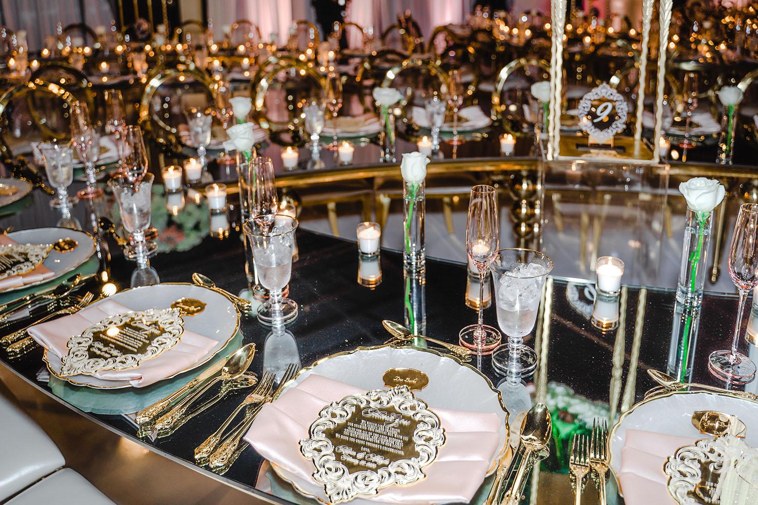 ceiling decor, cake drop, royal luxury, wedding reception decor, gold chairs, mirror tables, chargers, tableware, circle arch