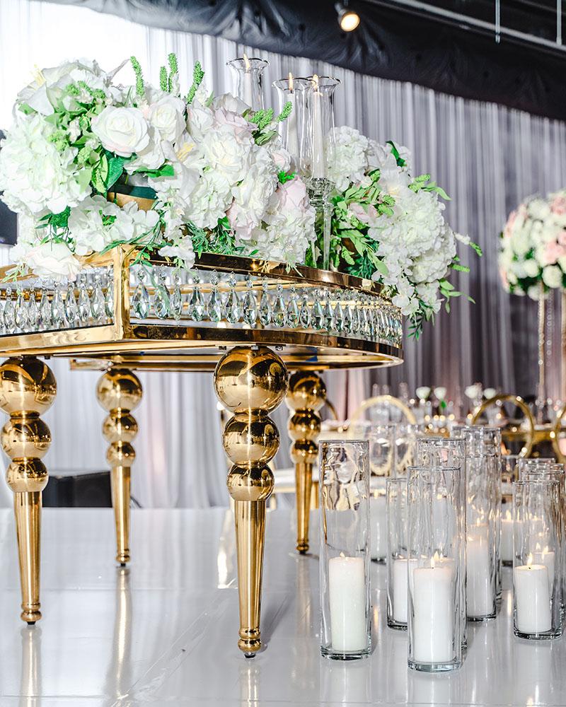 ceiling decor, cake drop, royal luxury, wedding reception decor, gold chairs, mirror tables, chargers, tableware, circle arch