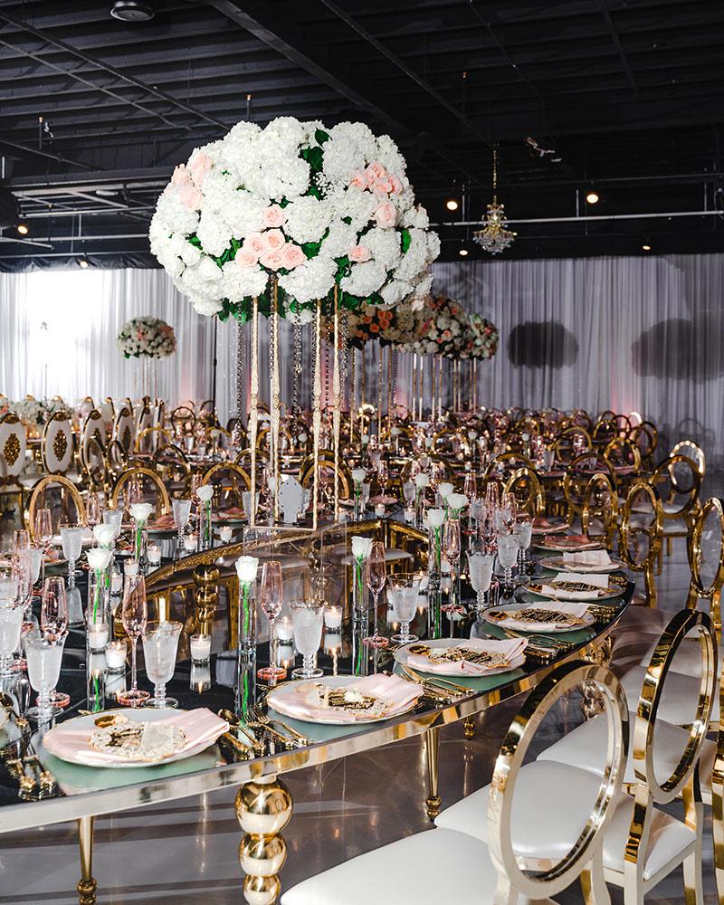ceiling decor, cake drop, royal luxury, wedding reception decor, gold chairs, mirror tables, chargers, tableware, circle arch