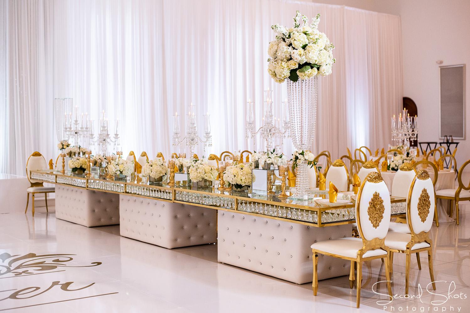 white and gold wedding decor - royal luxury events - rentals - flowers - gold chairs - fancy chairs