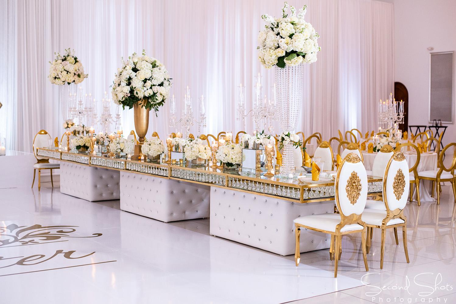 white and gold wedding decor - royal luxury events - rentals - flowers - gold chairs - fancy chairs
