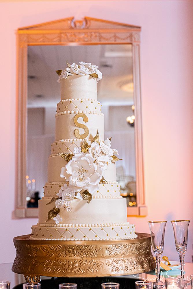 white and gold wedding decor - royal luxury events - rentals - flowers - gold chairs - fancy chairs
