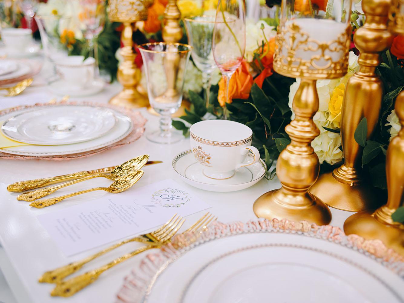 outdoor wedding reception - white chairs - pink napkins, charger plates, gold tableware, floral table runner, wedding cake, pink, yellow, orange, bouquet, houstonian, royal luxury events