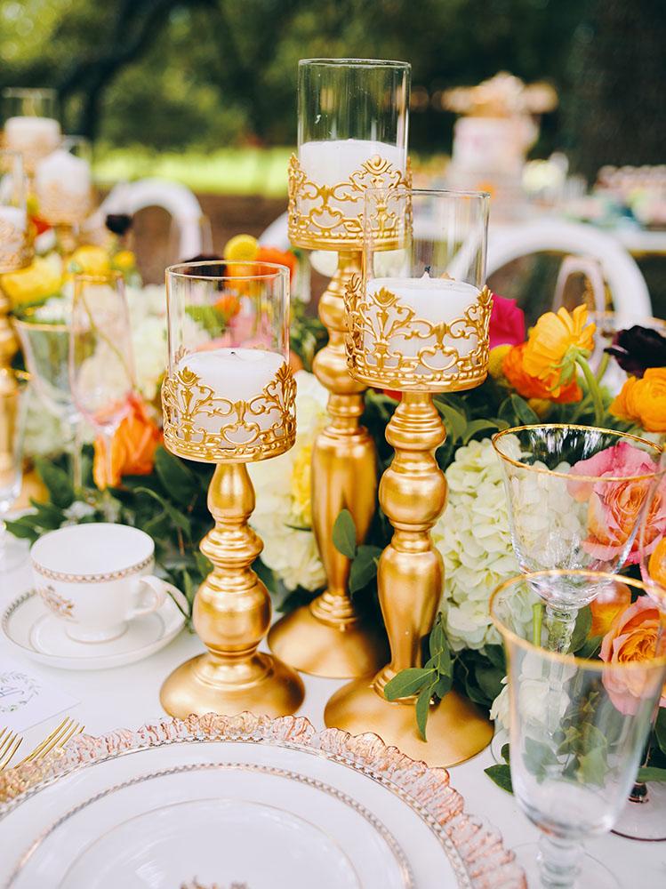 outdoor wedding reception - white chairs - pink napkins, charger plates, gold tableware, floral table runner, wedding cake, pink, yellow, orange, bouquet, houstonian, royal luxury events