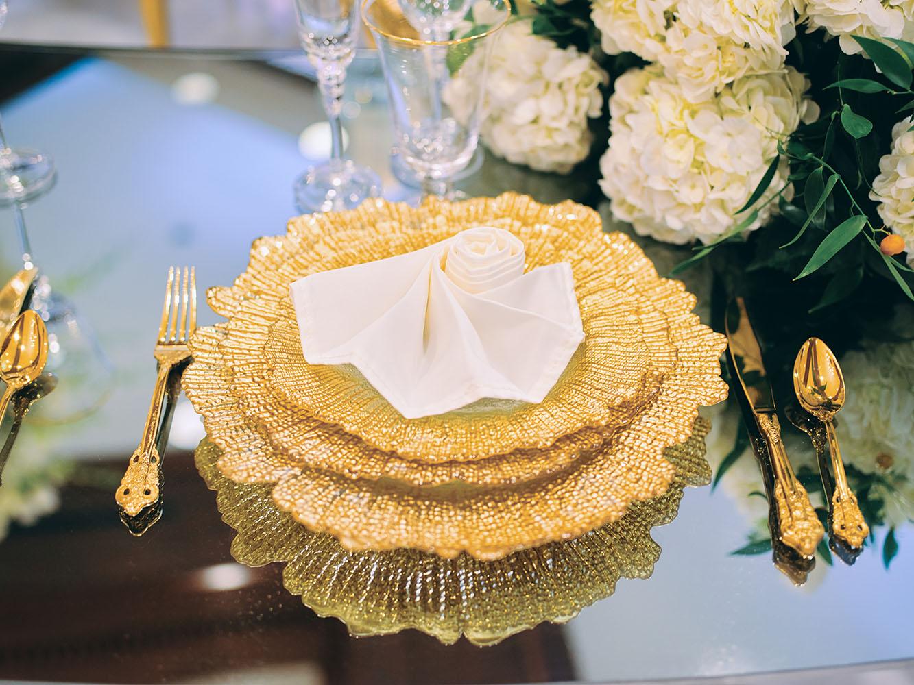 indoor wedding reception decor, white gold, wedding cake, gold chargers, mirror teardrop tables, centerpieces, florist, houstonian, luxury wedding in houston