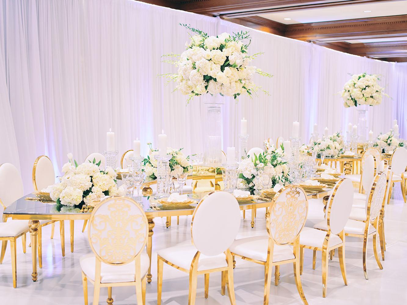 indoor wedding reception decor, white gold, wedding cake, gold chargers, mirror teardrop tables, centerpieces, florist, houstonian, luxury wedding in houston