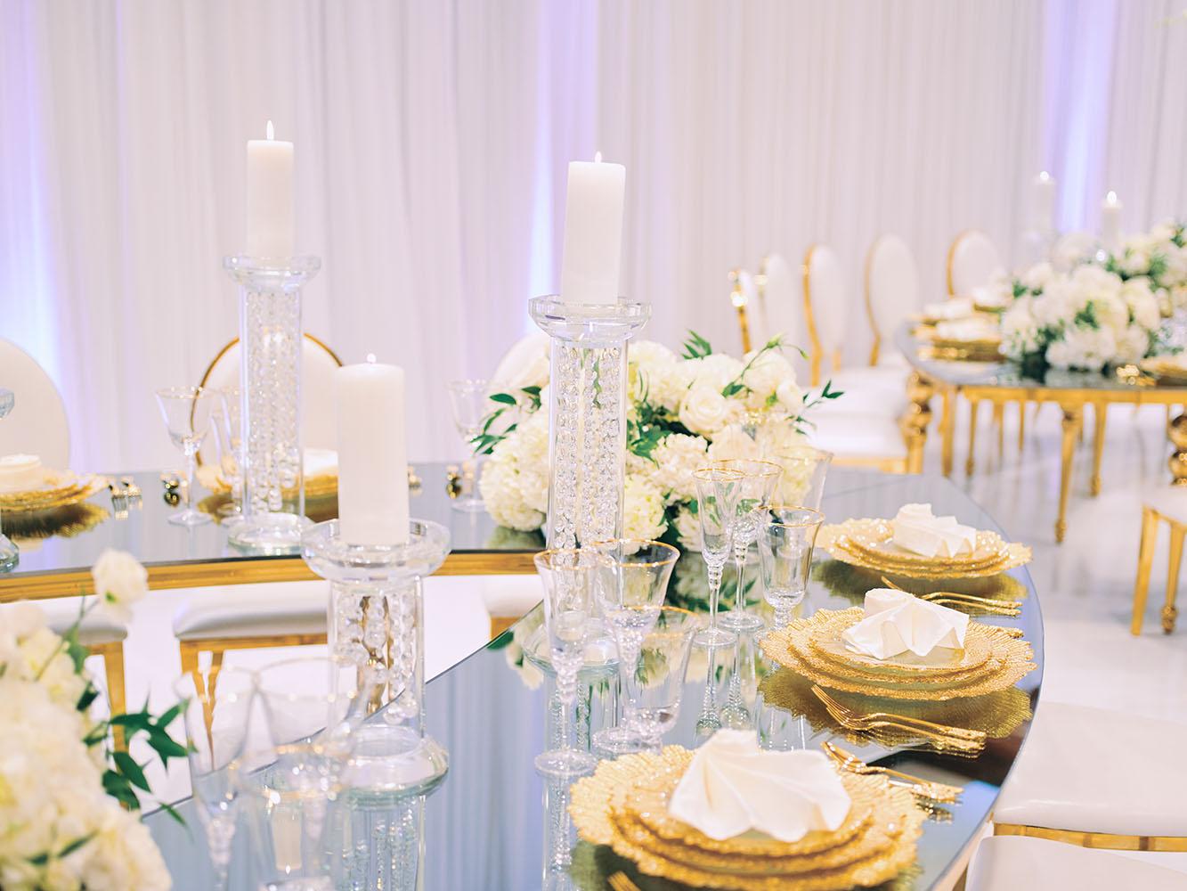 indoor wedding reception decor, white gold, wedding cake, gold chargers, mirror teardrop tables, centerpieces, florist, houstonian, luxury wedding in houston