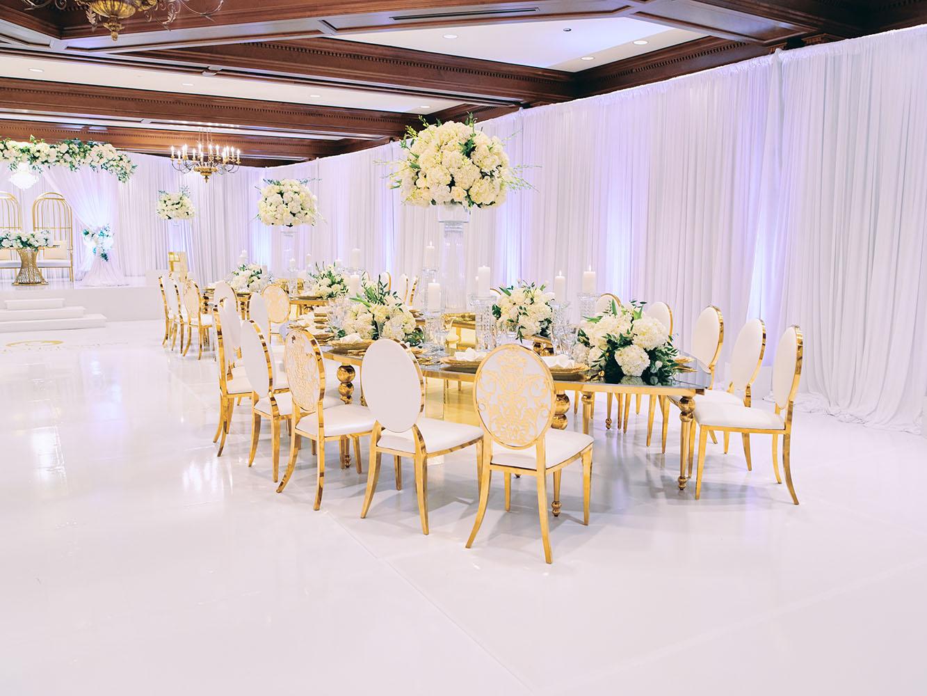 indoor wedding reception decor, white gold, wedding cake, gold chargers, mirror teardrop tables, centerpieces, florist, houstonian, luxury wedding in houston