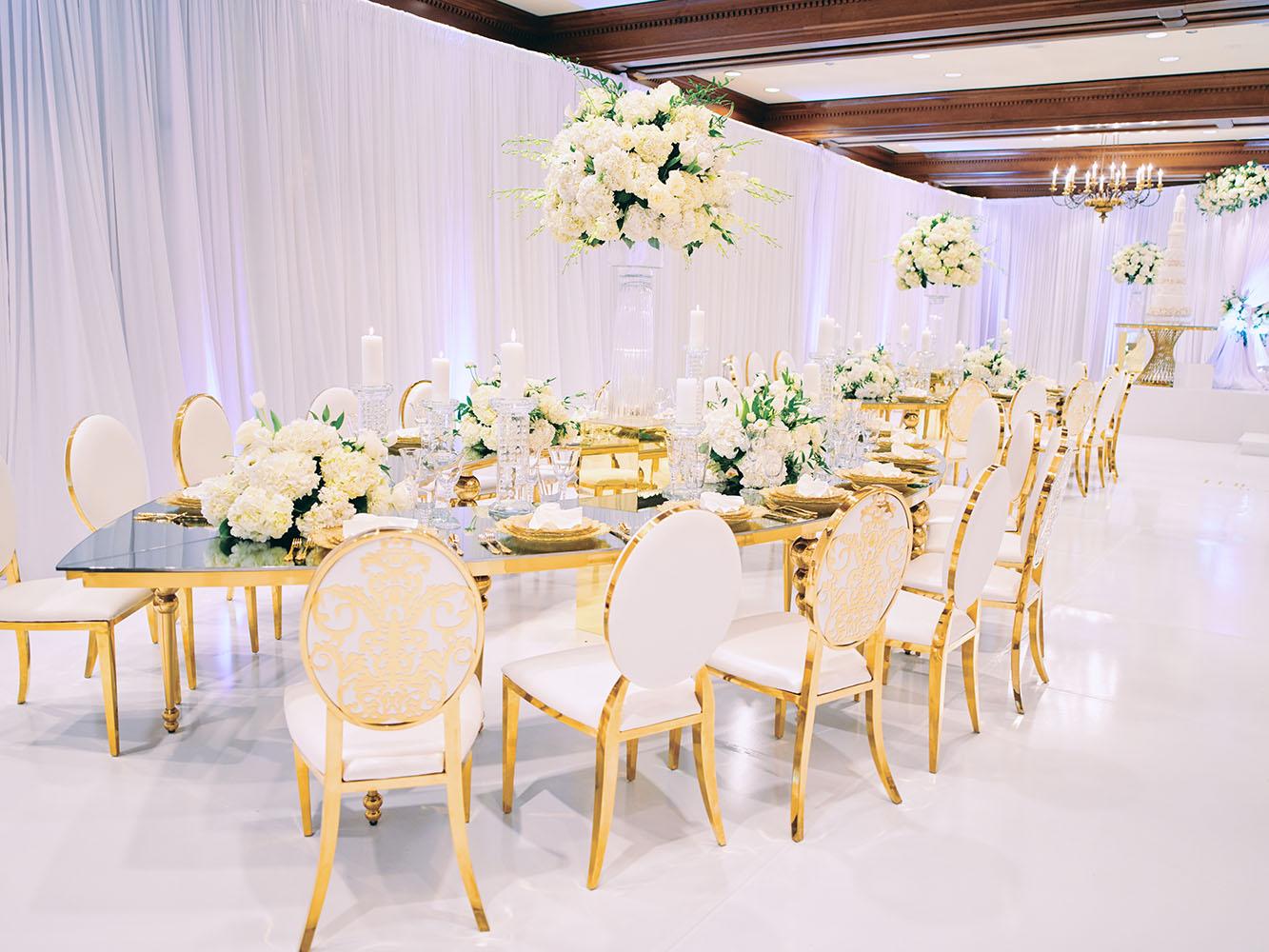 indoor wedding reception decor, white gold, wedding cake, gold chargers, mirror teardrop tables, centerpieces, florist, houstonian, luxury wedding in houston