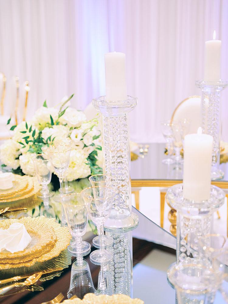 indoor wedding reception decor, white gold, wedding cake, gold chargers, mirror teardrop tables, centerpieces, florist, houstonian, luxury wedding in houston