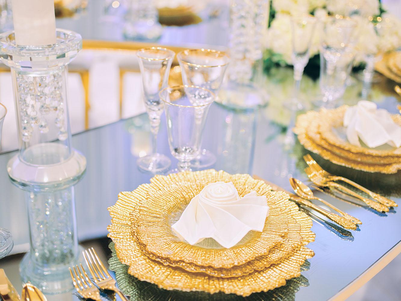 indoor wedding reception decor, white gold, wedding cake, gold chargers, mirror teardrop tables, centerpieces, florist, houstonian, luxury wedding in houston