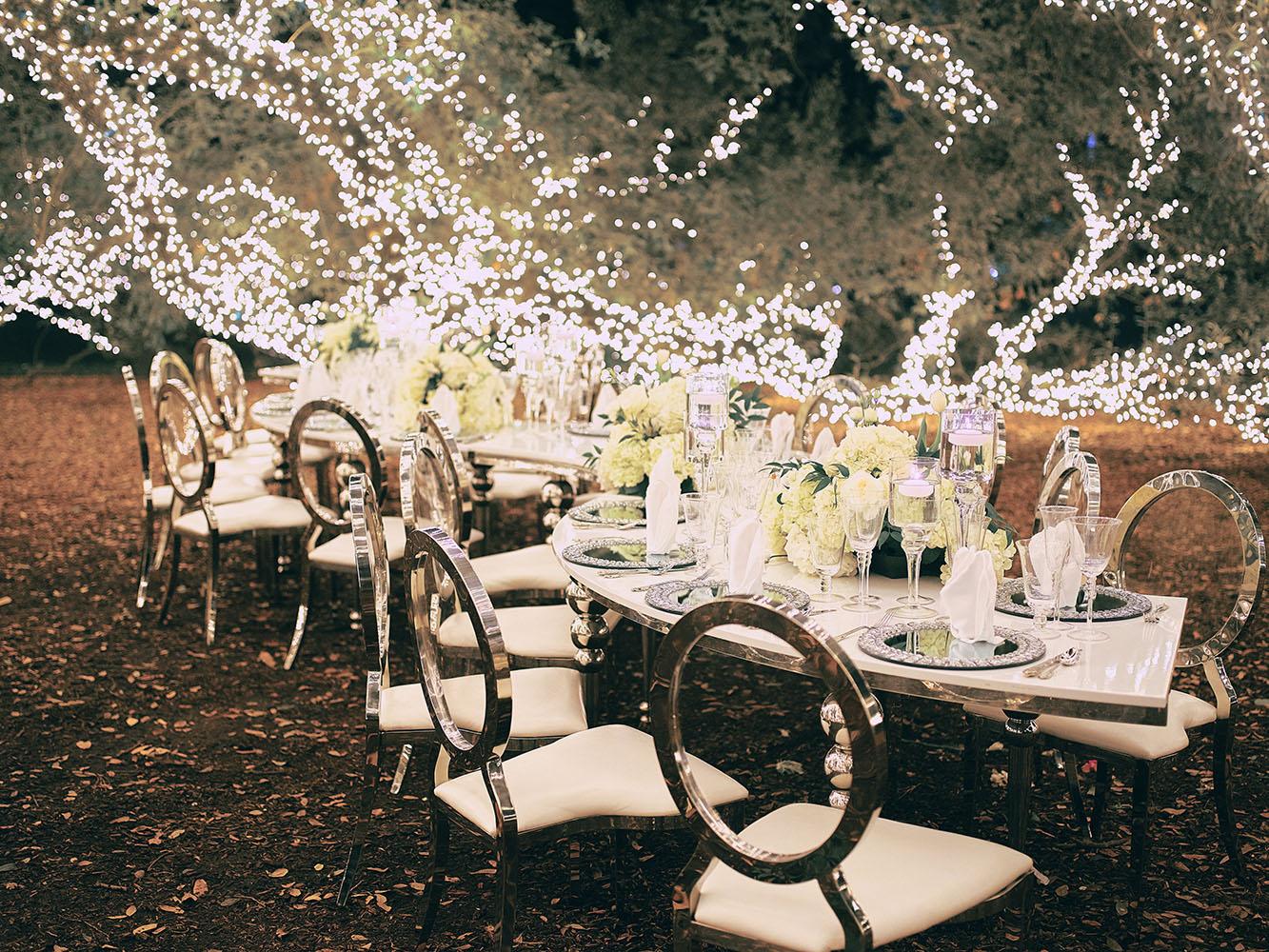 outdoor night wedding reception decor - serpentine table - silver - lights - houstonian - luxury houston wedding