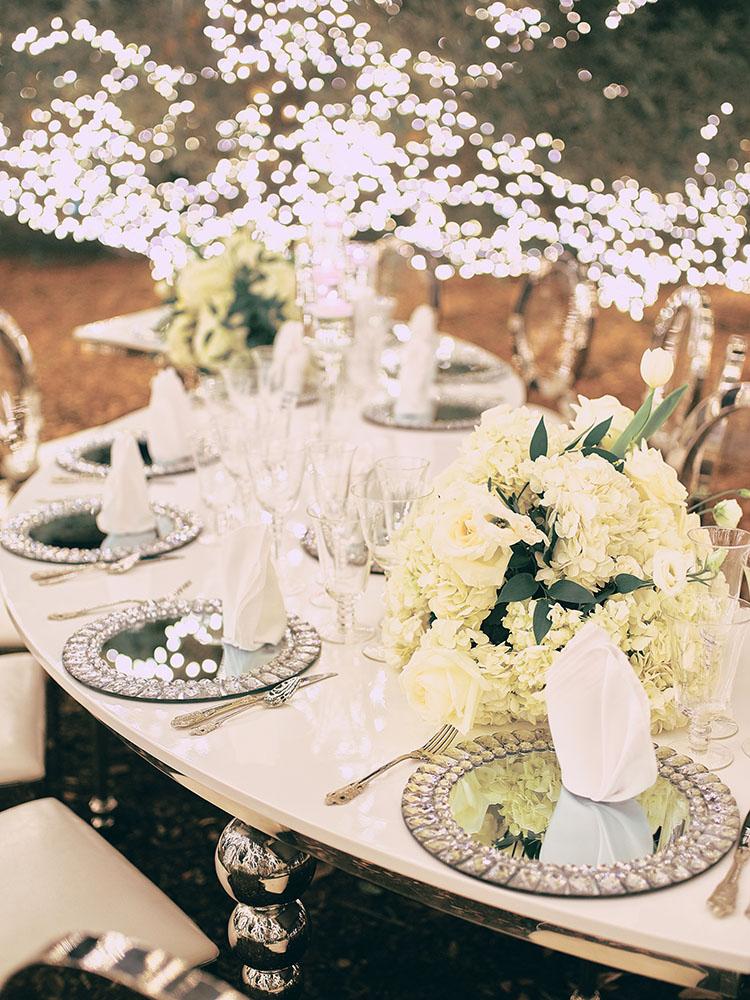 outdoor night wedding reception decor - serpentine table - silver - lights - houstonian - luxury houston wedding