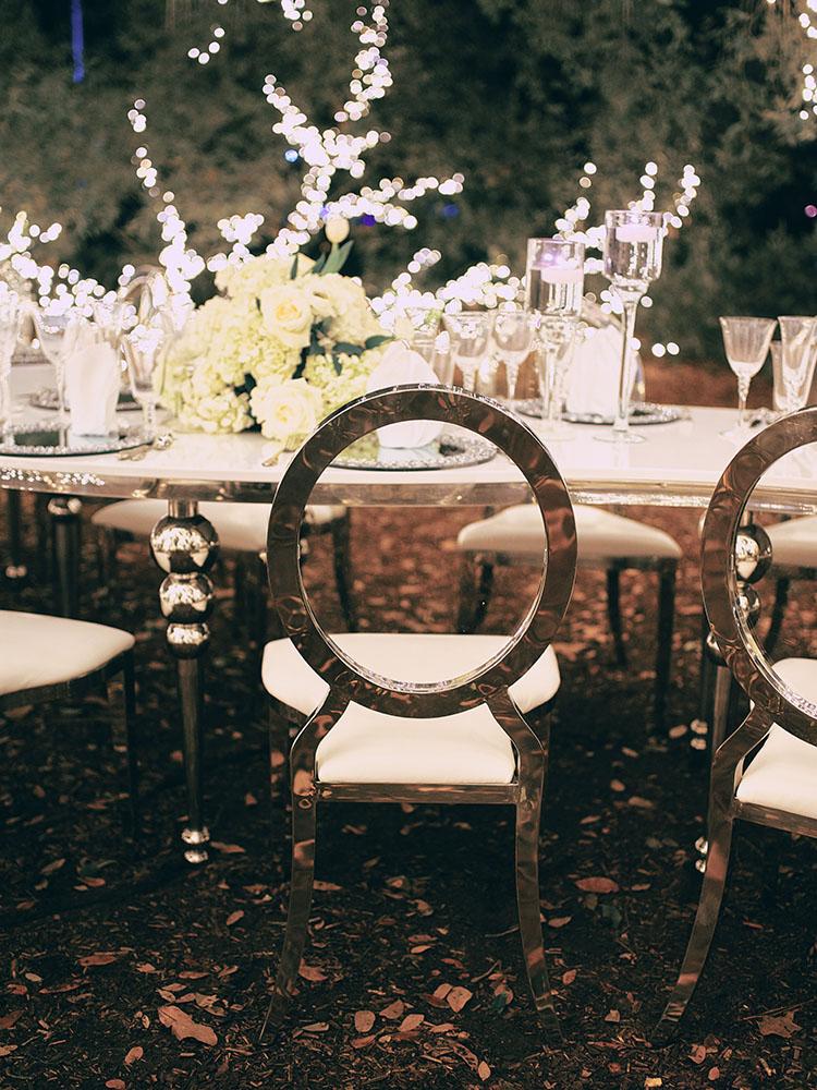 outdoor night wedding reception decor - serpentine table - silver - lights - houstonian - luxury houston wedding