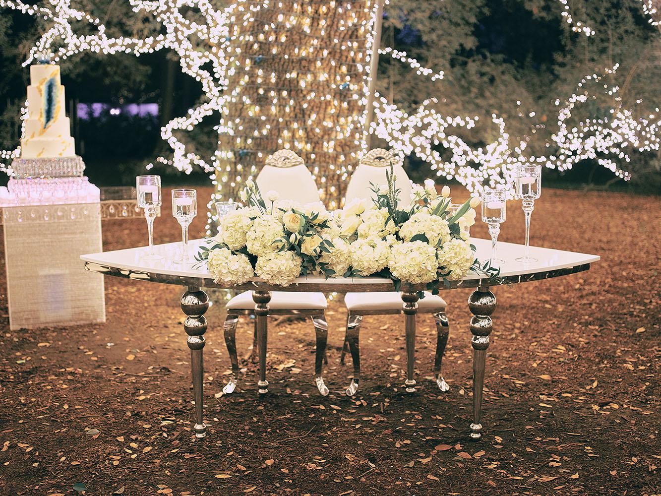 outdoor night wedding reception decor - serpentine table - silver - lights - houstonian - luxury houston wedding
