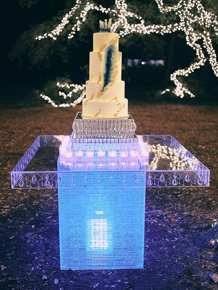 outdoor night wedding reception decor - serpentine table - silver - lights - houstonian - luxury houston wedding