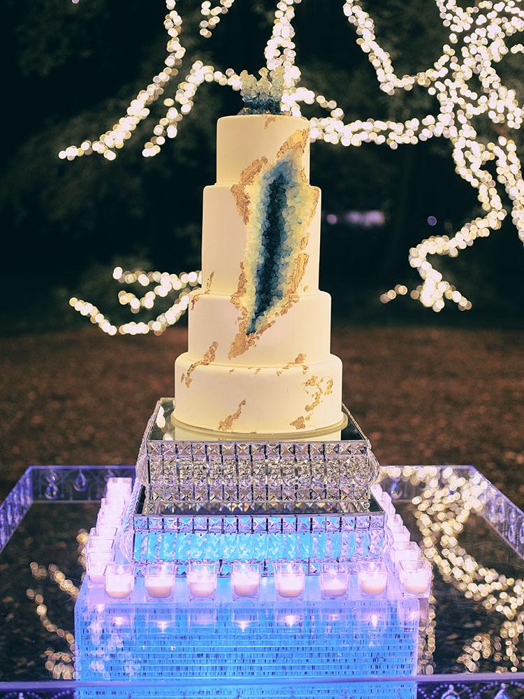 outdoor night wedding reception decor - serpentine table - silver - lights - houstonian - luxury houston wedding