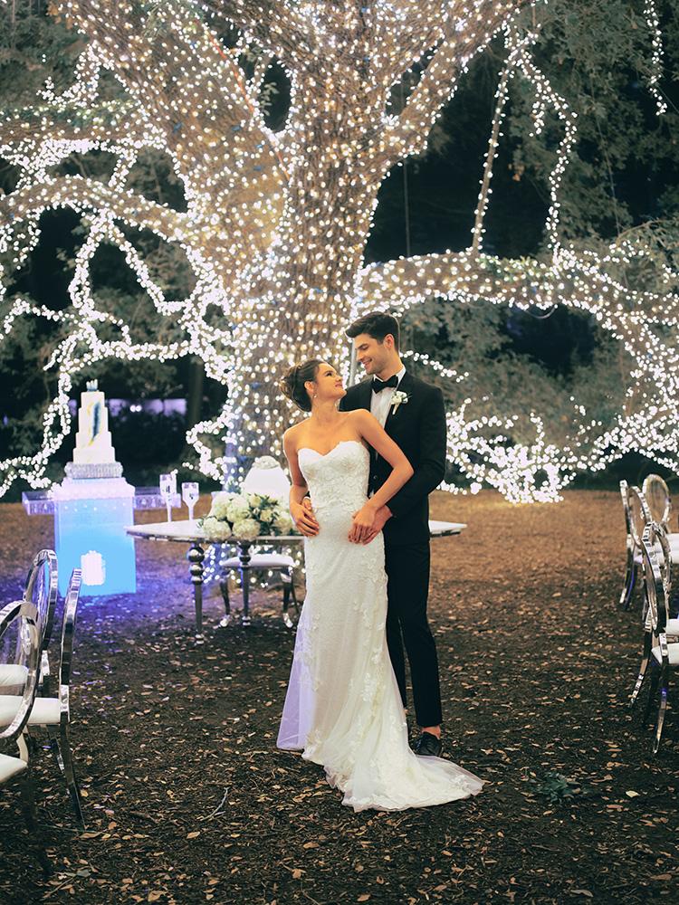 outdoor night wedding reception decor - serpentine table - silver - lights - houstonian - luxury houston wedding