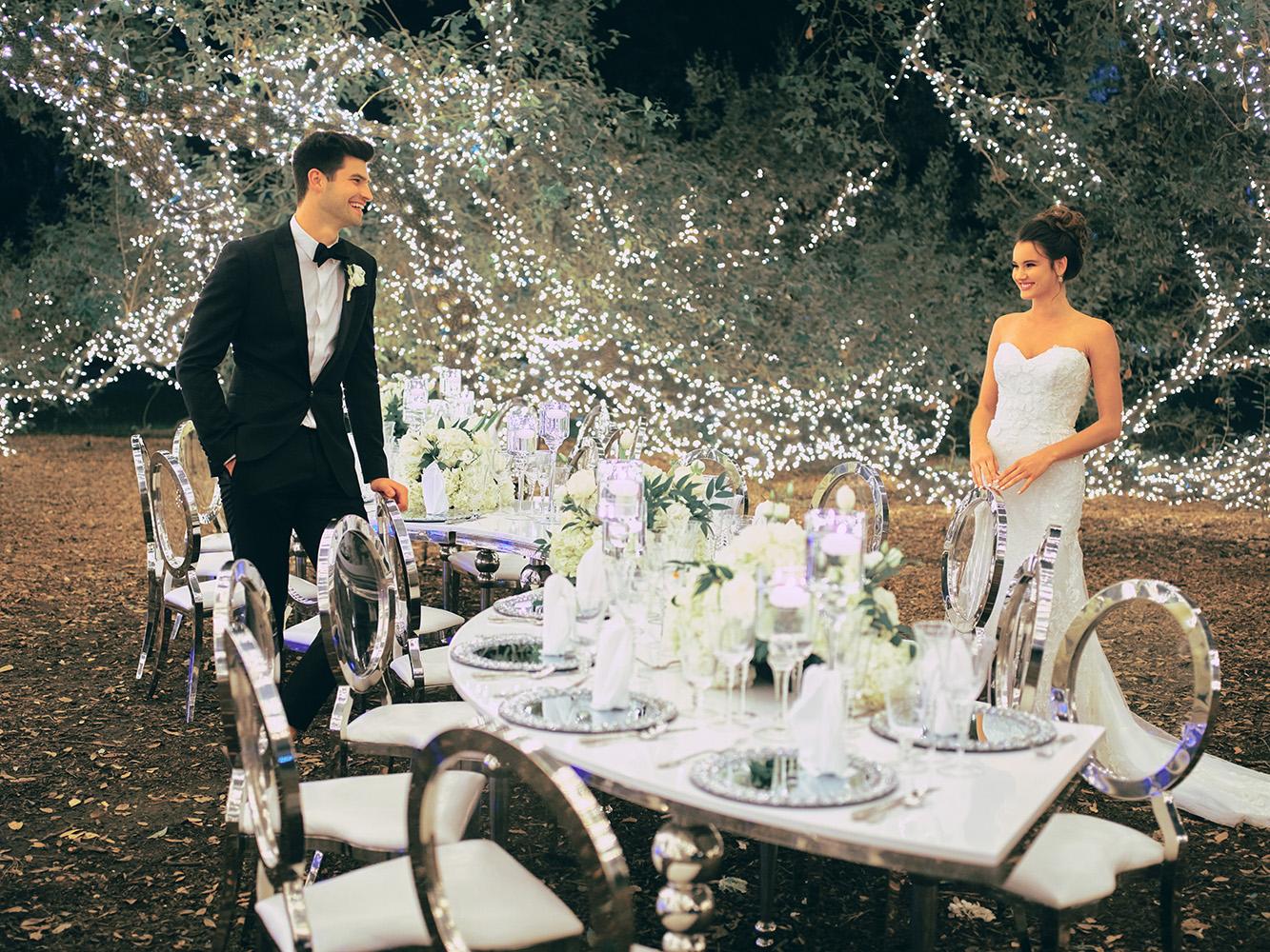 outdoor night wedding reception decor - serpentine table - silver - lights - houstonian - luxury houston wedding