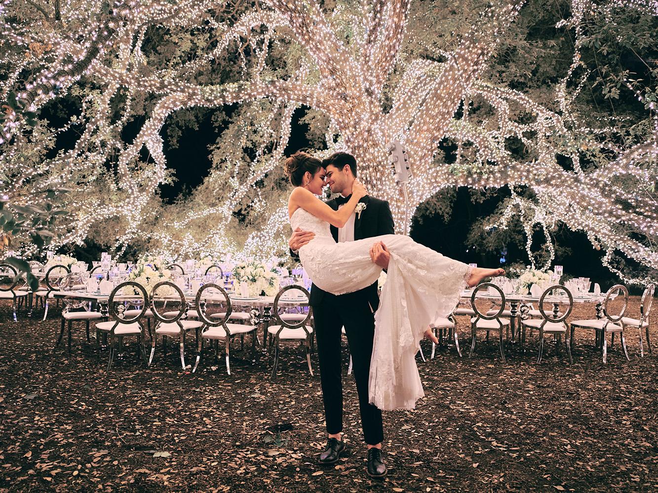 outdoor night wedding reception decor - serpentine table - silver - lights - houstonian - luxury houston wedding