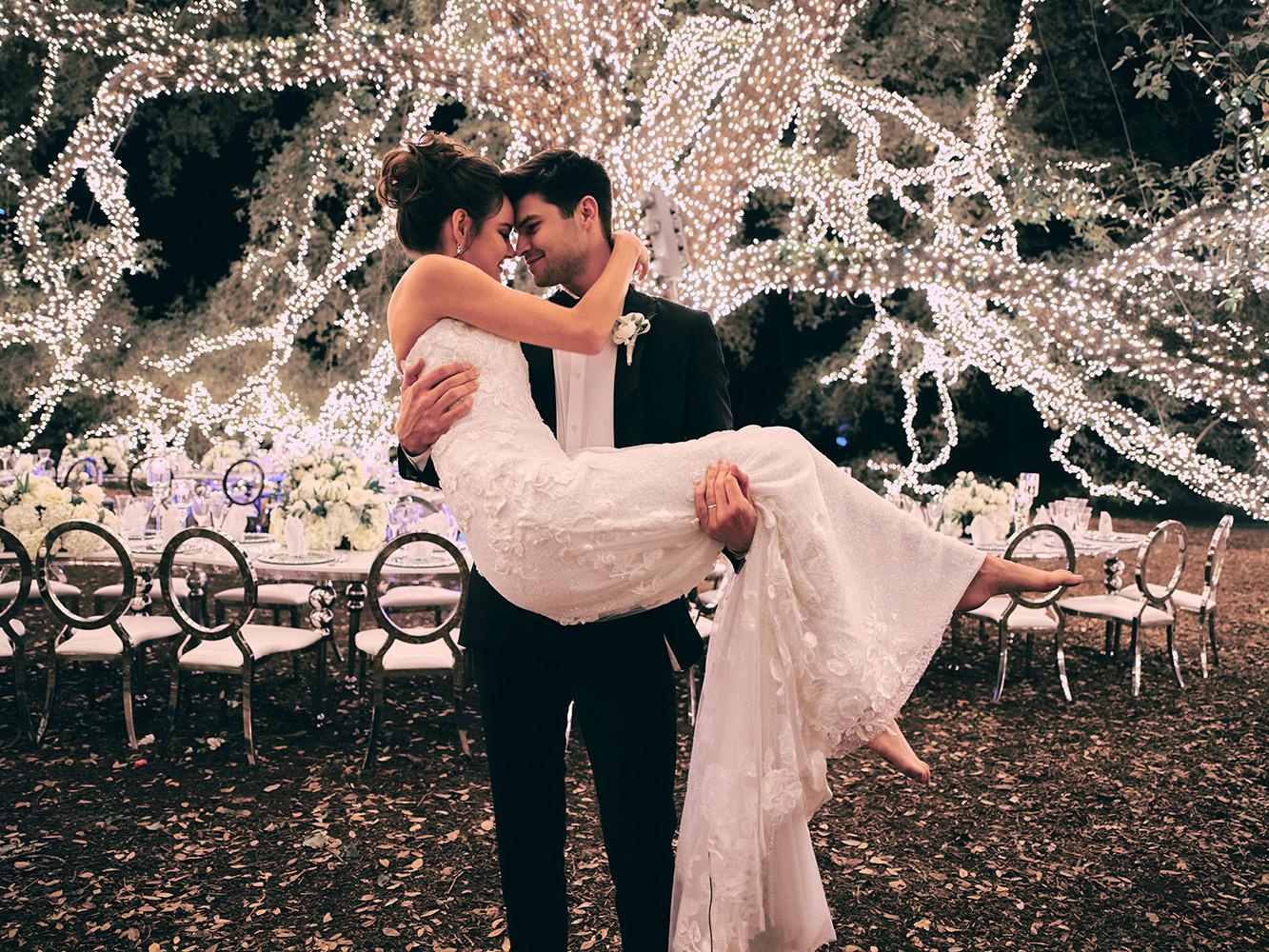 outdoor night wedding reception decor - serpentine table - silver - lights - houstonian - luxury houston wedding