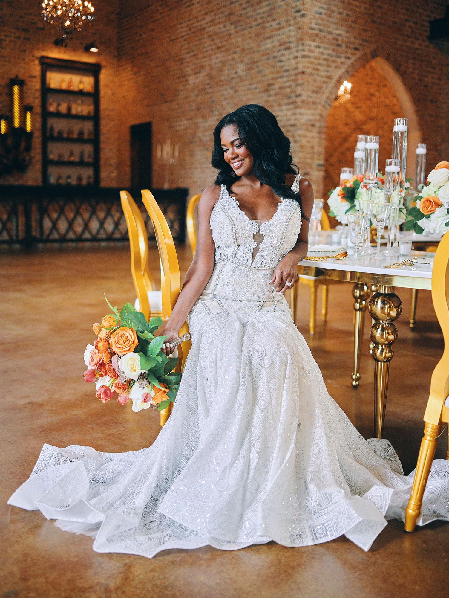 luxurious indoor wedding reception decor - gold luxury chairs - round table