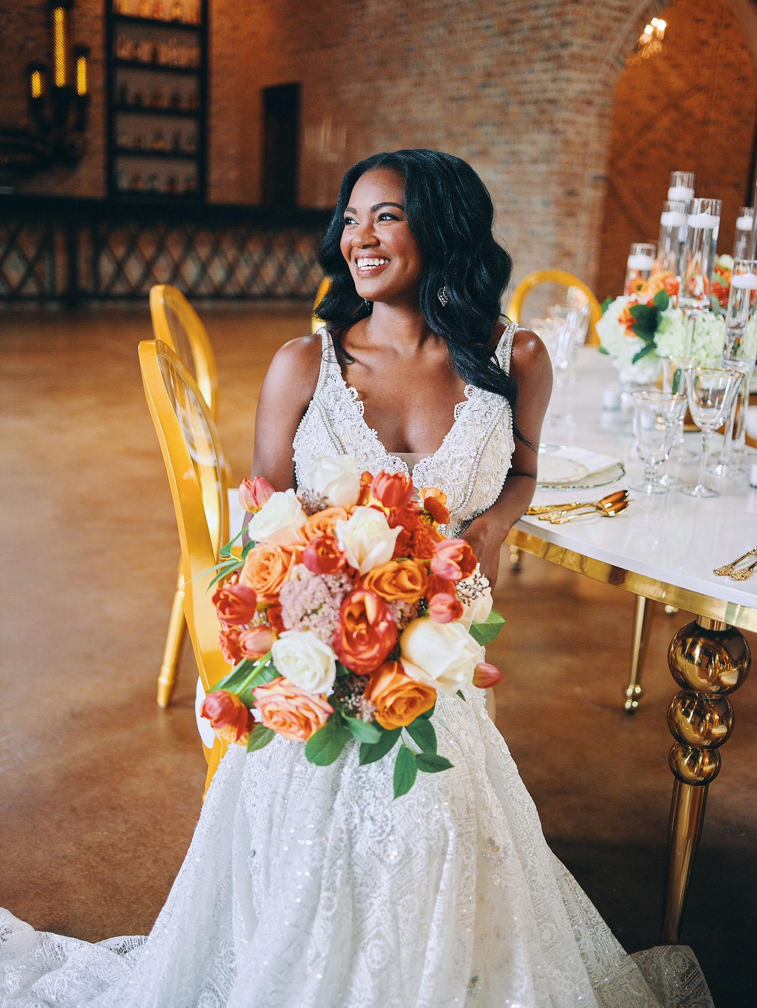 luxurious indoor wedding reception decor - gold luxury chairs - round table