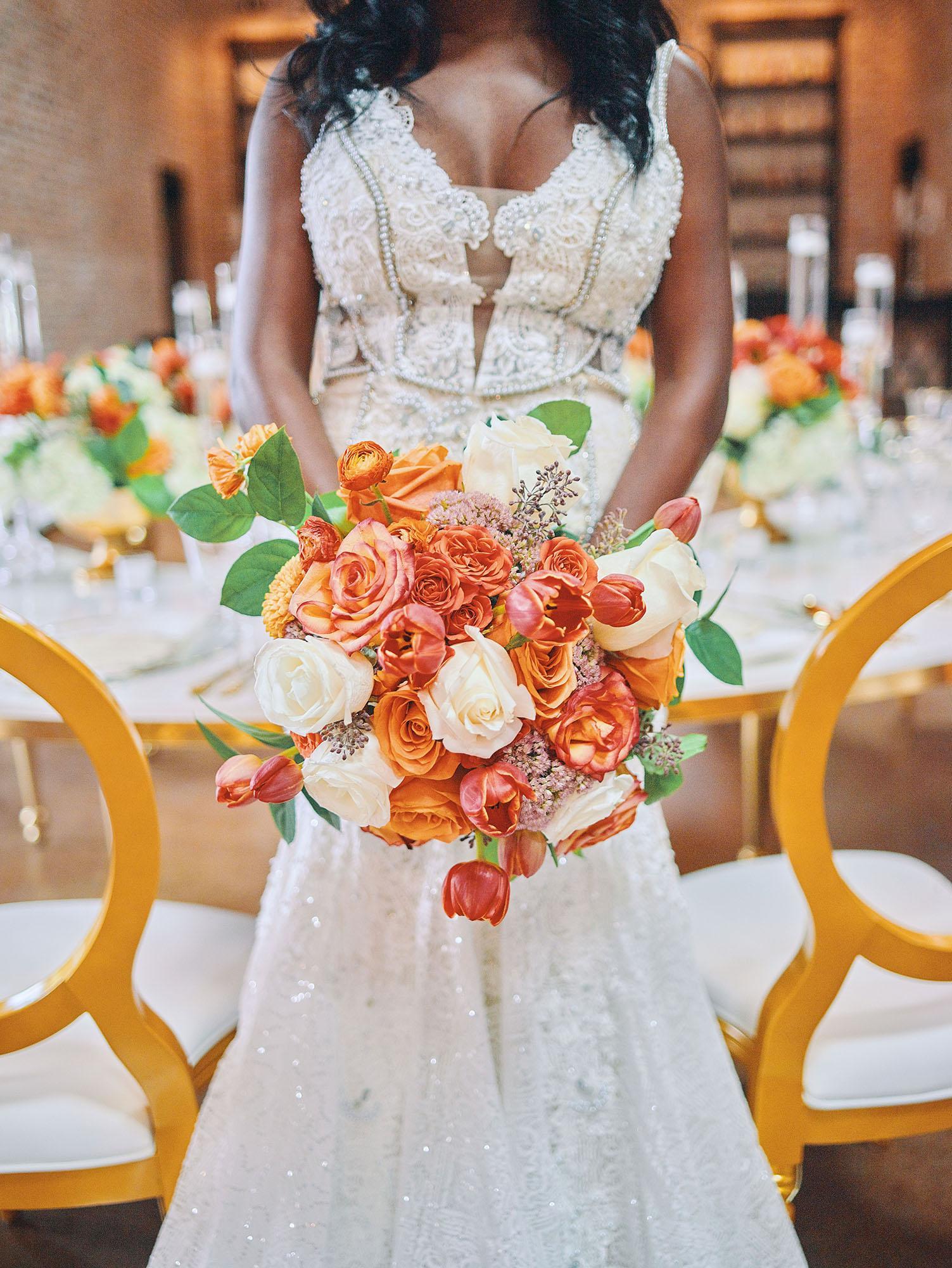 luxurious indoor wedding reception decor - gold luxury chairs - round table