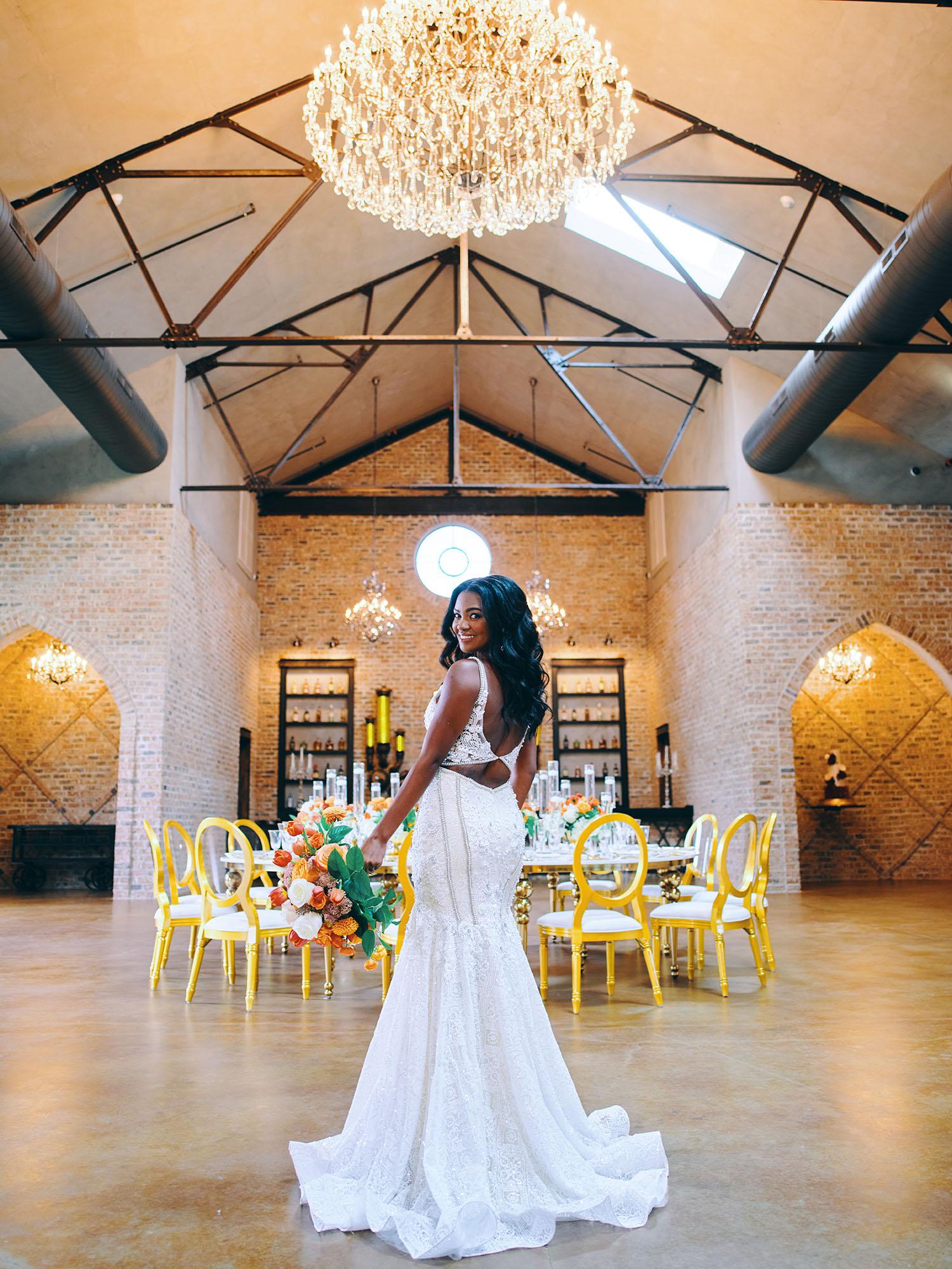 luxurious indoor wedding reception decor - gold luxury chairs - round table