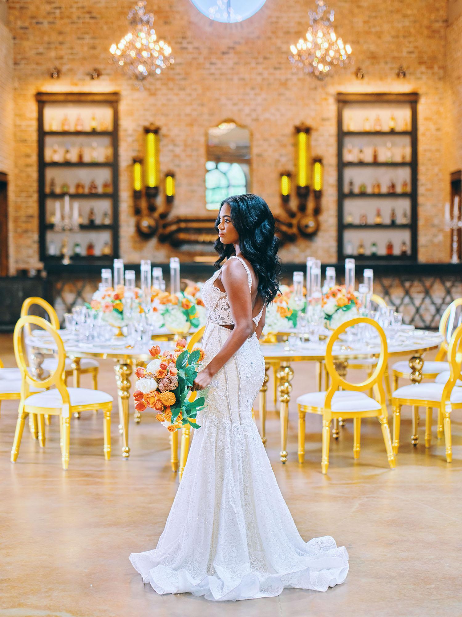 luxurious indoor wedding reception decor - gold luxury chairs - round table