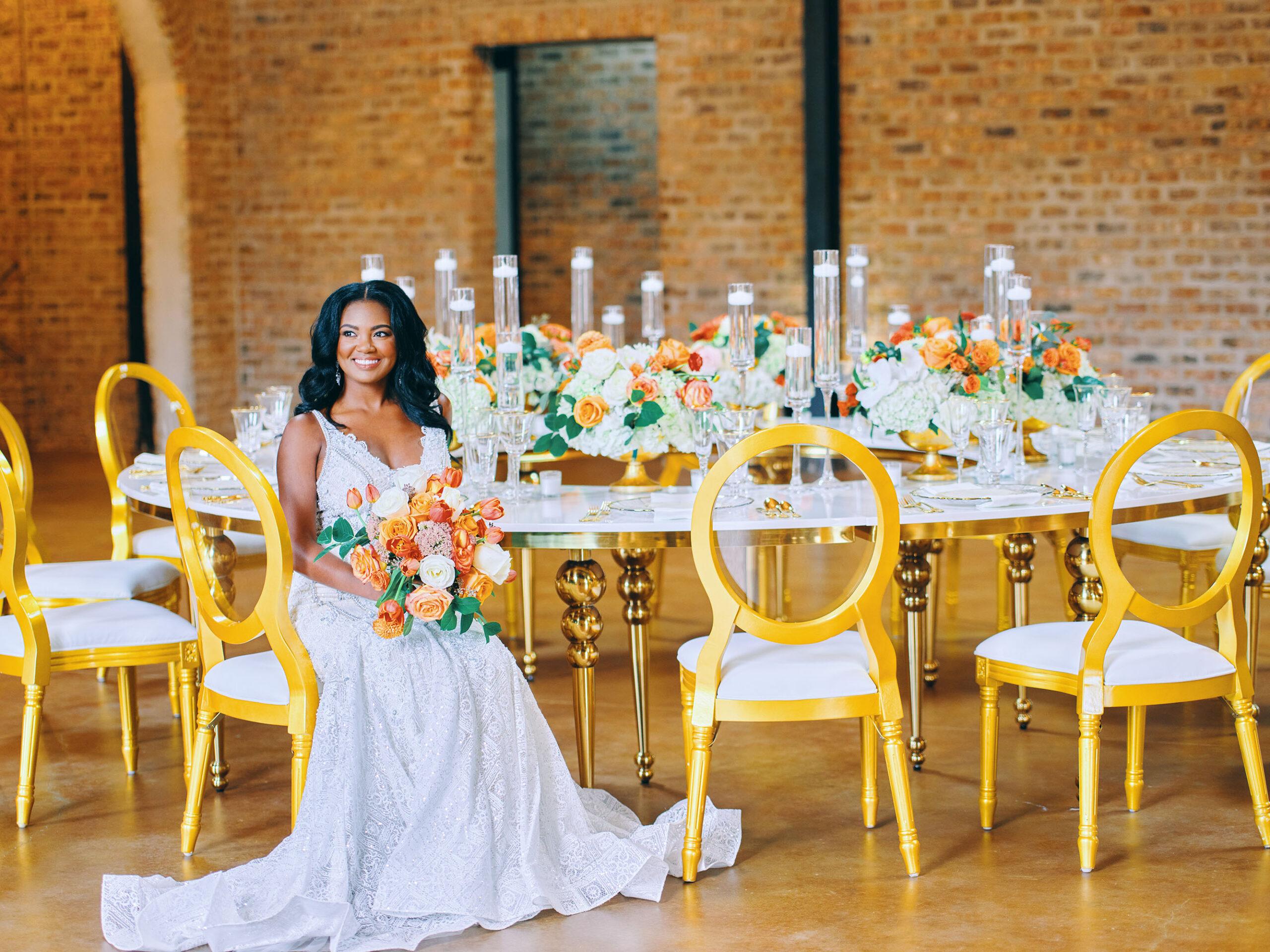 luxurious indoor wedding reception decor - gold luxury chairs - round table