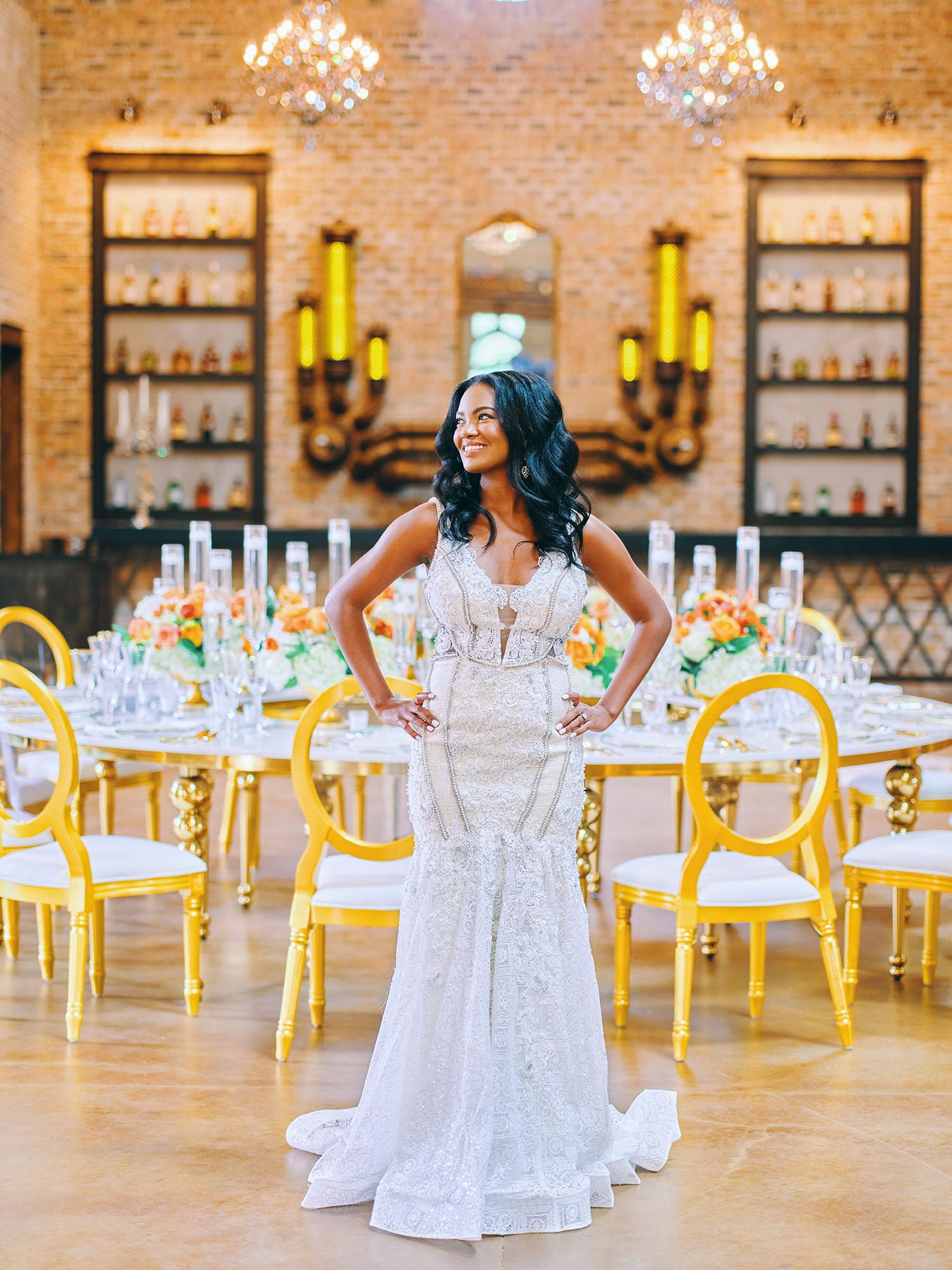 luxurious indoor wedding reception decor - gold luxury chairs - round table