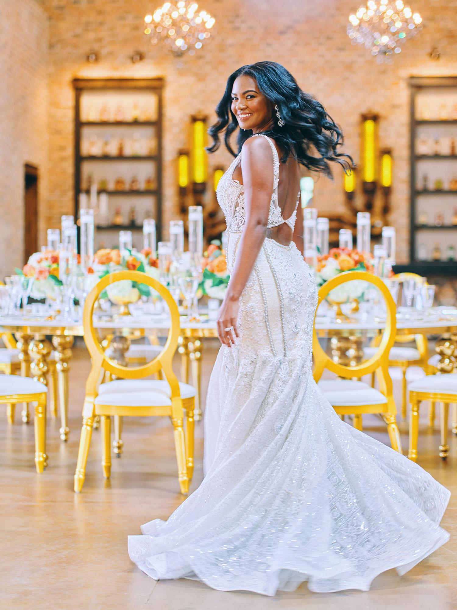 luxurious indoor wedding reception decor - gold luxury chairs - round table