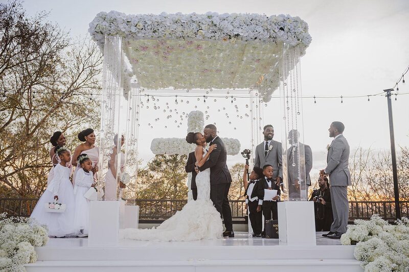 mirror aisle, royal luxury events, ceremony decor, ivory flowers, canopy, cross, clear chairs