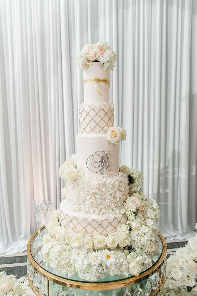Wisteria, Baby's Breath, reception decor, omni houston, wedding decor, florist in houston, gold round table, mirror seating chart, wedding cake