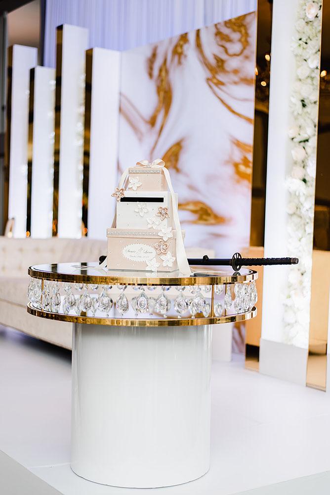 Wisteria, Baby's Breath, reception decor, omni houston, wedding decor, florist in houston, gold round table, mirror seating chart, wedding cake