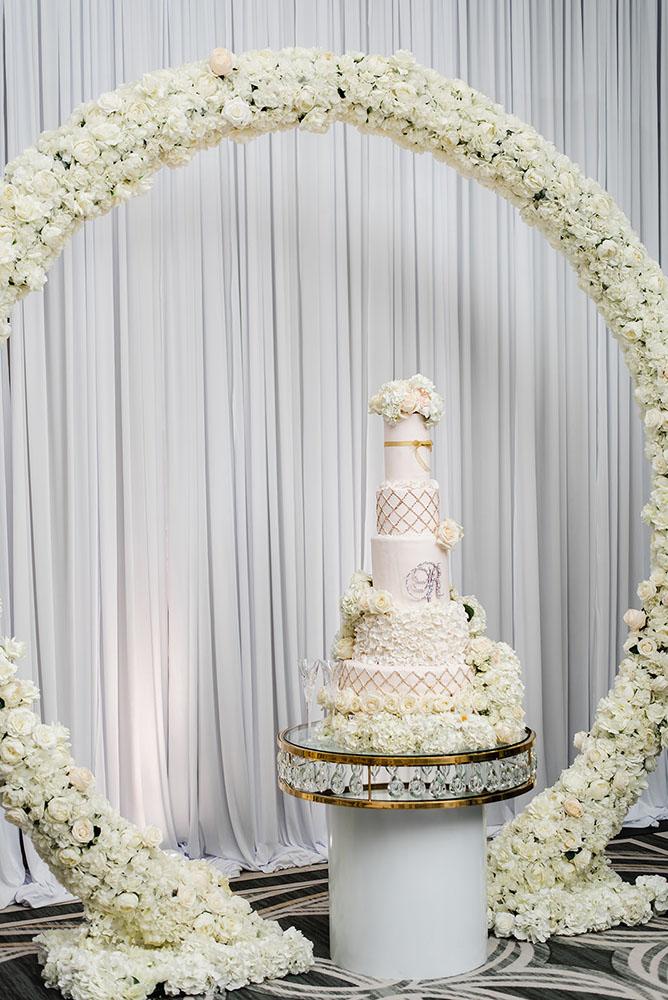 Wisteria, Baby's Breath, reception decor, omni houston, wedding decor, florist in houston, gold round table, mirror seating chart, wedding cake