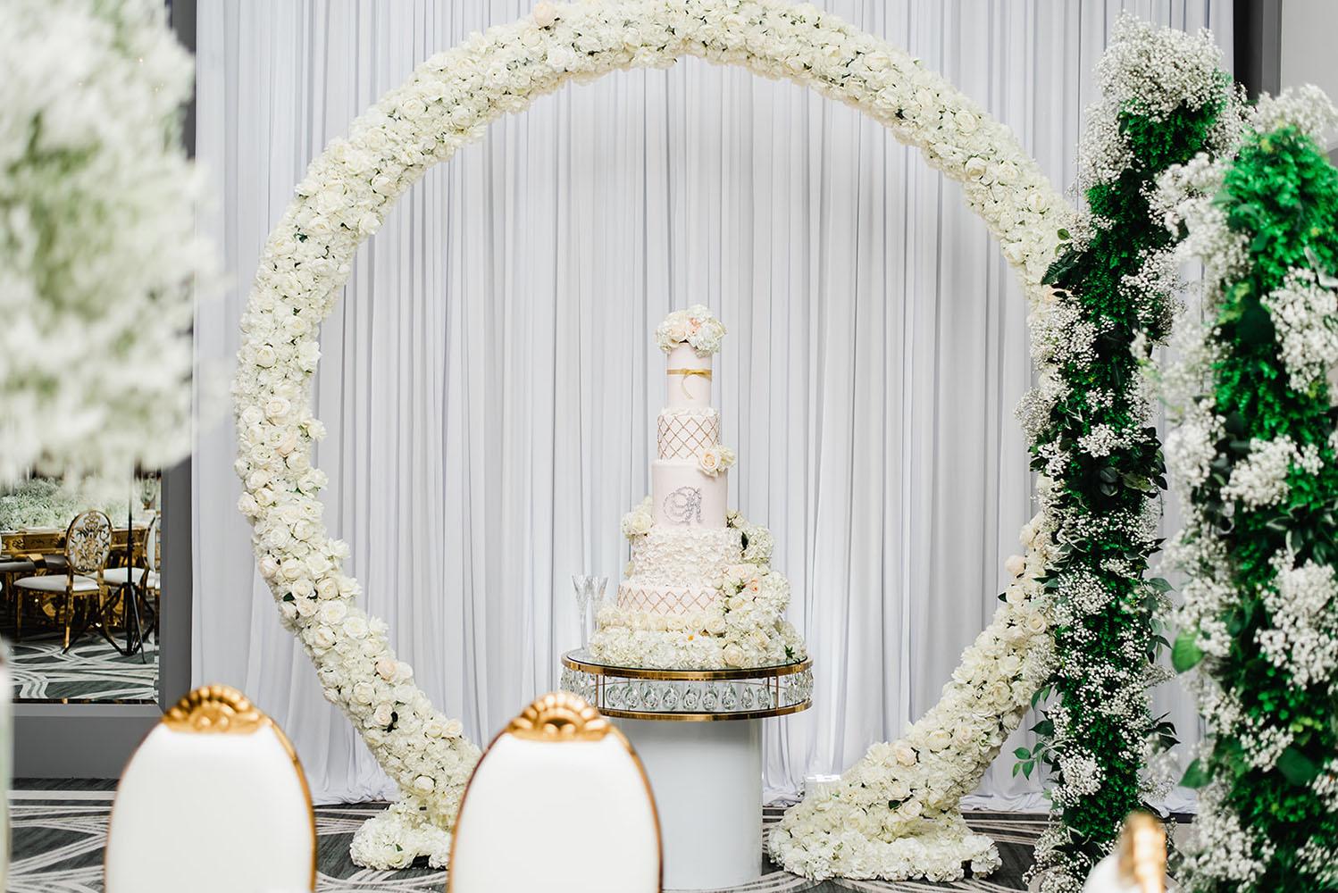 Wisteria, Baby's Breath, reception decor, omni houston, wedding decor, florist in houston, gold round table, mirror seating chart, wedding cake