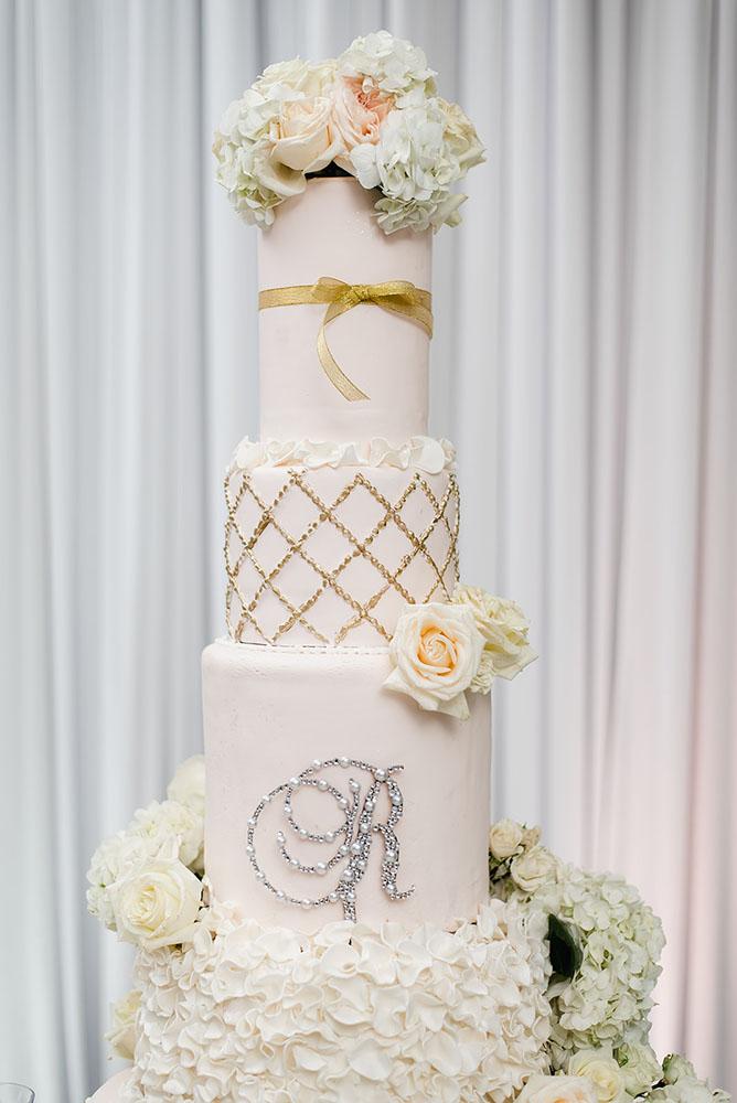 Wisteria, Baby's Breath, reception decor, omni houston, wedding decor, florist in houston, gold round table, mirror seating chart, wedding cake