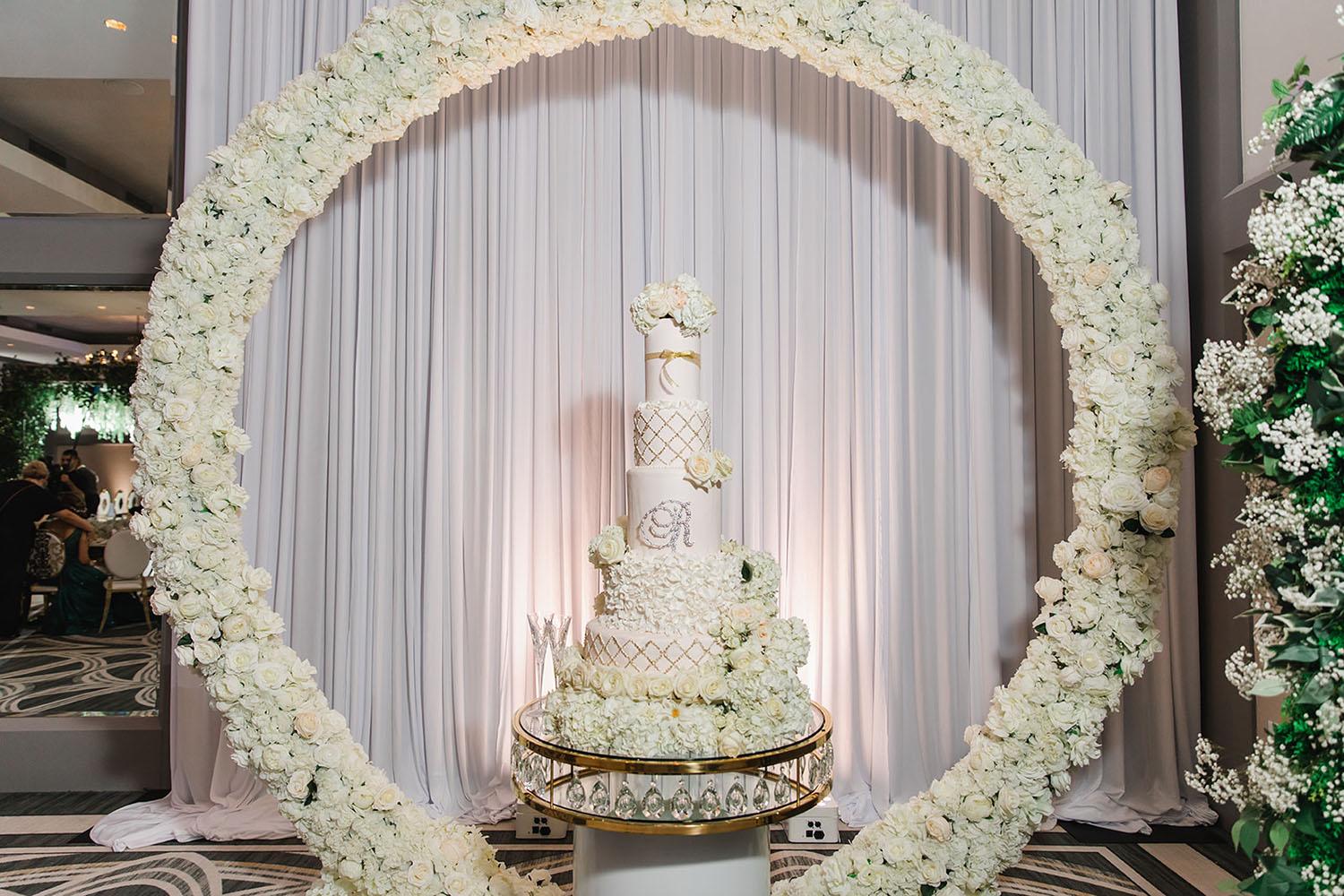 Wisteria, Baby's Breath, reception decor, omni houston, wedding decor, florist in houston, gold round table, mirror seating chart, wedding cake